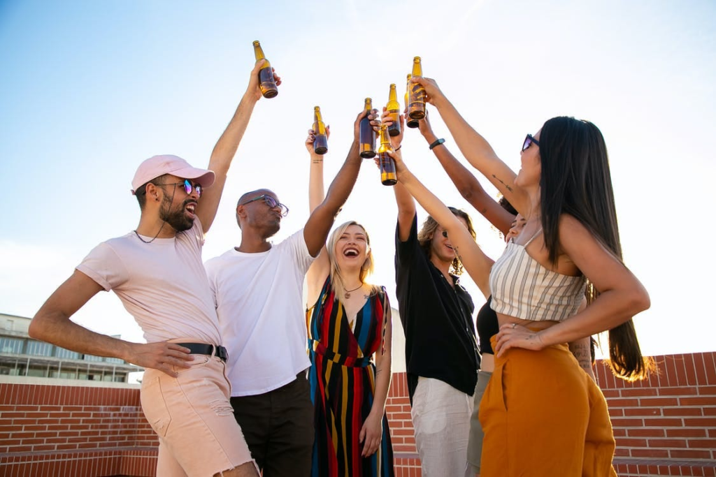 Friends having fun together after communicating in nice ways to say 'pay for your own meal' on invitations